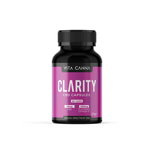Load image into Gallery viewer, A black bottle labeled "Vitacanna 1000mg Broad Spectrum CBD Vegan Capsules - 50 Caps" with a pink and white design from Vitacanna, featuring 50 vegan capsules, broad spectrum CBD, flaxseed (Omega-3), and is THC free.