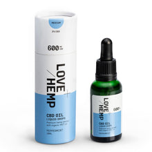 Load image into Gallery viewer, Image of a Love Hemp branded CBD oil product. The packaging includes a tall cylindrical container labeled "Love Hemp 600mg Peppermint CBD Oil - 30ml, Medium" and a smaller dark green dropper bottle with a black cap, also labeled similarly. Both items are positioned against a white background and feature organic MCT oil.