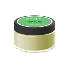 Load image into Gallery viewer, A small, round, clear container with a black lid, labeled "Sensi CBD" in white text on a green background. This natural vegan-friendly container holds 100mg of Sensi CBD Massage Wax—a light green, creamy product designed for therapeutic relief.